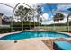 Inviting screened-in pool and spa with a spacious deck perfect for outdoor relaxation and entertaining at 10532 Plantation Bay Dr, Tampa, FL 33647
