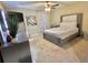 Stylish bedroom showcasing a luxurious bed, modern dresser, and a comfortable and inviting atmosphere at 10924 Summerton Dr, Riverview, FL 33579