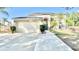 Two-story home features a well-manicured lawn, driveway, and a two car garage at 10924 Summerton Dr, Riverview, FL 33579