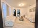 Cozy living room featuring two sofas, sleek hardwood floors, and an open layout with views to the stairs at 10924 Summerton Dr, Riverview, FL 33579