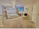 Comfortable main bedroom with a plush bed, ceiling fan, TV, and neutral décor creating a relaxing retreat at 10924 Summerton Dr, Riverview, FL 33579