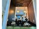Unique wet bar with black granite countertops and hardwood flooring at 10924 Summerton Dr, Riverview, FL 33579
