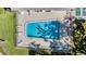 Aerial view of pool with lounge chairs and a patio deck within a fenced in area at 11511 113Th St # 22E, Largo, FL 33778