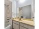Bathroom with combination tub and shower, vanity, and large mirror at 11511 113Th St # 22E, Largo, FL 33778