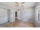Comfortable bedroom with closet, neutral paint, and laminate wood flooring at 11511 113Th St # 22E, Largo, FL 33778