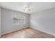 Cozy bedroom with natural light, ceiling fan, and wood-look flooring at 11511 113Th St # 22E, Largo, FL 33778