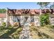 Charming townhome with well-maintained lawn, walkway and shade trees, offering great curb appeal at 11511 113Th St # 22E, Largo, FL 33778