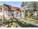 Charming townhome featuring a well-maintained lawn, walkway, and mature shade trees, adding to its curb appeal at 11511 113Th St # 22E, Largo, FL 33778