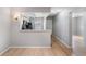 Open concept living room with updated flooring and view into the kitchen area at 11511 113Th St # 22E, Largo, FL 33778