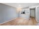Spacious living room featuring modern flooring, neutral paint, and abundant natural light at 11511 113Th St # 22E, Largo, FL 33778