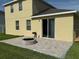 Inviting backyard patio with a built-in fire pit, perfect for outdoor entertaining and relaxation at 12231 Fairlawn Dr, Riverview, FL 33579