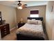 Comfortable bedroom with a queen bed, dresser, and soft lighting, perfect for relaxation and restful nights at 12231 Fairlawn Dr, Riverview, FL 33579