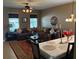 An elegant dining room featuring a large window, a dining table and lots of space at 12231 Fairlawn Dr, Riverview, FL 33579