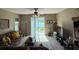 Cozy living room with a sliding glass door and a relaxing atmosphere at 12231 Fairlawn Dr, Riverview, FL 33579