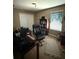 Functional home office with desk, comfortable chair, bookshelf, and neutral decor creating productive workspace at 12231 Fairlawn Dr, Riverview, FL 33579