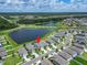Residential street near a lake; home's location is marked by a red circle at 12826 French Market Dr, Riverview, FL 33579