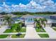 Beautiful aerial view of a charming home near the lake, showcasing lush landscaping and a serene environment at 12826 French Market Dr, Riverview, FL 33579