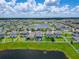Neighborhood homes with fenced-in backyards including one with a private screened-in pool at 12826 French Market Dr, Riverview, FL 33579