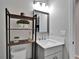 Stylish powder room boasting modern fixtures and a chic, minimalist design at 12826 French Market Dr, Riverview, FL 33579