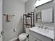 Updated half bathroom featuring contemporary fixtures and stylish decor for added convenience at 12826 French Market Dr, Riverview, FL 33579