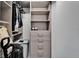 Custom closet with drawers, shelves, and hanging rods to provide smart storage solutions and organization at 12826 French Market Dr, Riverview, FL 33579