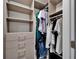 Walk-in closet offering plenty of storage with custom shelving, drawers, and hanging space for organization at 12826 French Market Dr, Riverview, FL 33579
