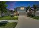 Beautiful two-story home with well-kept lawn, palm trees, and a spacious driveway at 12826 French Market Dr, Riverview, FL 33579