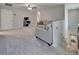 Open loft area with neutral carpeting, a ceiling fan, and comfortable seating offers a flexible living space at 12826 French Market Dr, Riverview, FL 33579