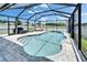 Beautiful screened-in pool featuring ample seating and lush landscaping for a relaxing outdoor experience at 12826 French Market Dr, Riverview, FL 33579