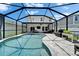 Beautiful screened-in pool area with patio, BBQ, and lush landscaping, perfect for outdoor relaxation and entertainment at 12826 French Market Dr, Riverview, FL 33579