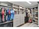 Spacious walk-in closet with custom organizers, shelving, drawers, and hanging rods at 12826 French Market Dr, Riverview, FL 33579