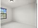 Bright bedroom with a large window allowing lots of natural light at 13299 Wildgrass Trl, Odessa, FL 33556