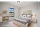 A comfy bedroom with stylish decorations, a bed and nightstands at 13299 Wildgrass Trl, Odessa, FL 33556