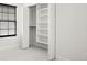 Bright closet with white shelving to hold lots of items at 13299 Wildgrass Trl, Odessa, FL 33556