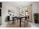 Elegant dining room featuring stylish lighting, windows, and a modern design at 13299 Wildgrass Trl, Odessa, FL 33556