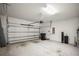 Spacious two car garage with opener, lighting, and plenty of storage at 13299 Wildgrass Trl, Odessa, FL 33556