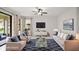 Beautiful living room with tile floors, ceiling fan, and access to outdoor space at 13299 Wildgrass Trl, Odessa, FL 33556
