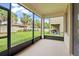 Outdoor patio overlooking fenced yard and landscaping, perfect for outdoor enjoyment at 13299 Wildgrass Trl, Odessa, FL 33556