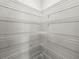 Spacious walk-in closet featuring ample wire shelving for optimal storage and organization at 13299 Wildgrass Trl, Odessa, FL 33556