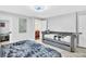 Bright bedroom with a daybed, queen bed and ensuite bathroom at 1384 S Hillcrest Ave, Clearwater, FL 33756