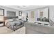 Comfortable bedroom featuring a queen bed, daybed, and bright, neutral decor at 1384 S Hillcrest Ave, Clearwater, FL 33756