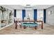 Elegant dining room with a wooden table, upholstered chairs, and a crystal chandelier at 1384 S Hillcrest Ave, Clearwater, FL 33756