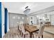 Chic dining area showcasing a wooden table, upholstered chairs, and a view to the kitchen at 1384 S Hillcrest Ave, Clearwater, FL 33756