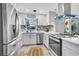 Modern kitchen with stainless steel appliances and marble backsplash at 1384 S Hillcrest Ave, Clearwater, FL 33756