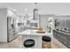 Bright, open kitchen with stainless steel appliances, island seating and modern finishes at 1384 S Hillcrest Ave, Clearwater, FL 33756