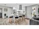 Modern kitchen with a center island, stainless steel appliances, and stylish pendant lighting at 1384 S Hillcrest Ave, Clearwater, FL 33756