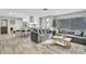 Open-concept living space with modern decor, connecting the kitchen and seating areas at 1384 S Hillcrest Ave, Clearwater, FL 33756