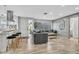 Stylish living room featuring modern furniture, sleek flooring, and an open floor plan at 1384 S Hillcrest Ave, Clearwater, FL 33756
