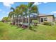 The backyard has a pool and lush landscaping, perfect for relaxation and outdoor enjoyment at 14514 Woodland Spur Dr, Lithia, FL 33547