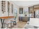 Elegant bar area with custom wine racks, beverage coolers, and stylish seating for entertaining guests at 14514 Woodland Spur Dr, Lithia, FL 33547